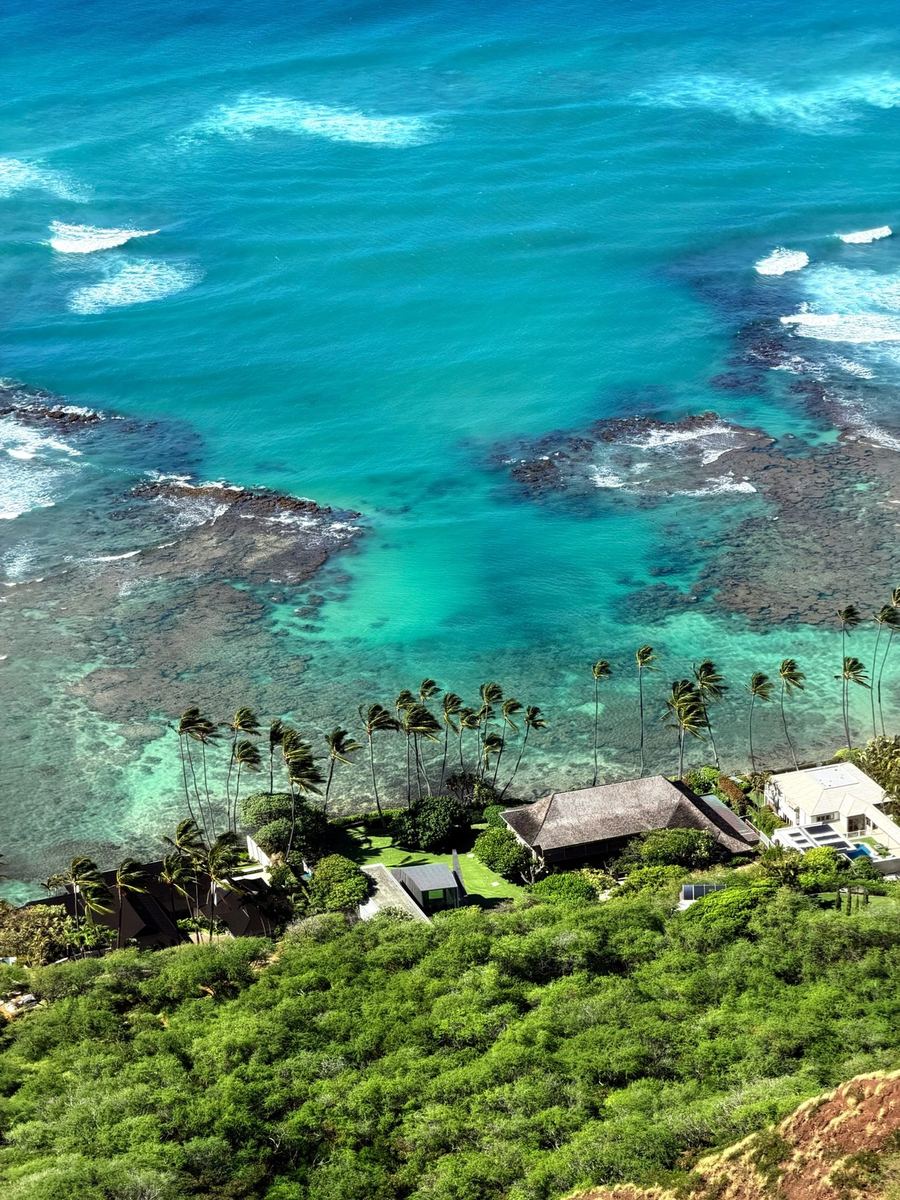 Aerial view of turquoise water and reef along the Oʻahu coastline
