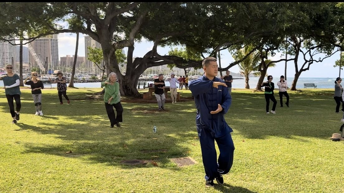 Wang Guolong leading a Tai Chi class at Magic Island